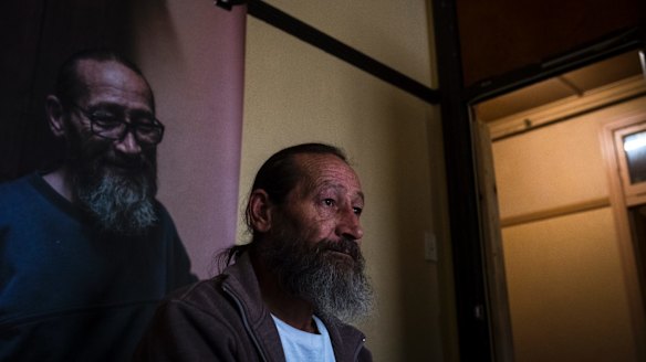 Allen Gamlen, 60, who called the Gatwick home on more than one occasion, is pictured in front of his portrait in his former bedroom.