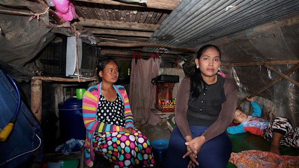 Inside Hour Vanny's cramped shanty home with her sister-in-law Som Tha Satry, 33, who gave birth to twins in October.