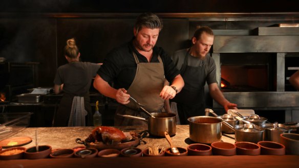 Scott Pickett at the helm of his fire-powered kitchen. 