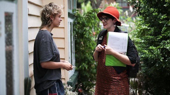 Amy MacMahon (right) doorknocking in her electorate.