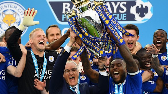 Foxes celebration:  Captain Wes Morgan and manager Claudio Ranieri  lift the Premier League Trophy.