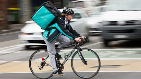 A Deliveroo driver in a previous version of the uniform.