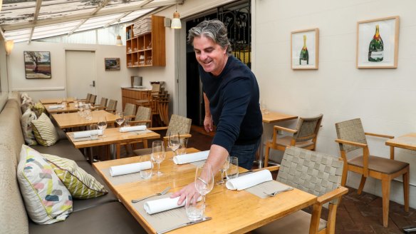 Stewart Parsons spaces out his tables at Bronte Road Bistro.