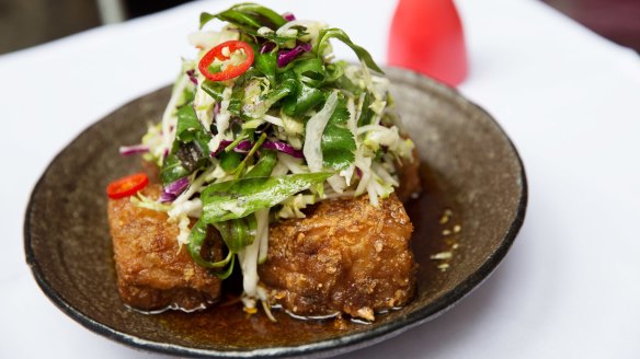 Red Spice Road's signature pork belly with chilli caramel, black vinegar and apple slaw.