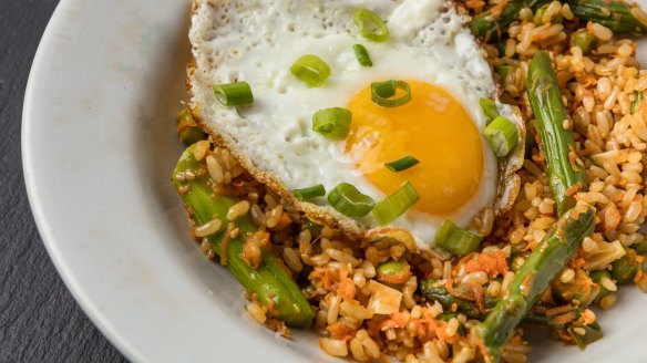 Put an egg on it: Sesame fried (brown) rice with vegetables and fried egg.