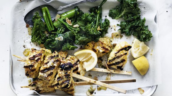 Turmeric fish skewers and garlic greens.