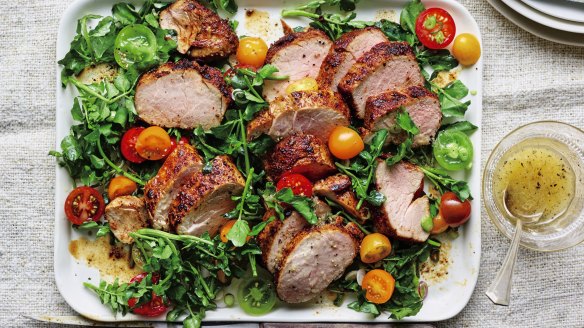 Spice-crusted roast pork fillet with salad.