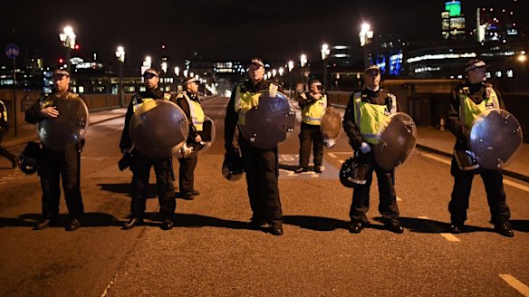 Police at the scene at Southwark Bridge in London.