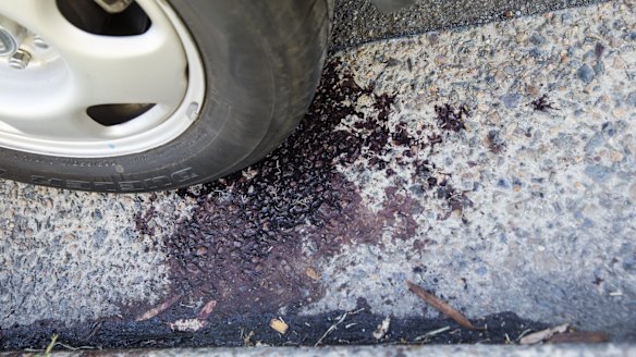 Blood on the road at Condell Park where two men were shot.