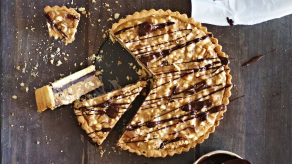 This tart holds two dense fillings: dark chocolate ganache topped with coffee, puffed buckwheat and pecan caramel.