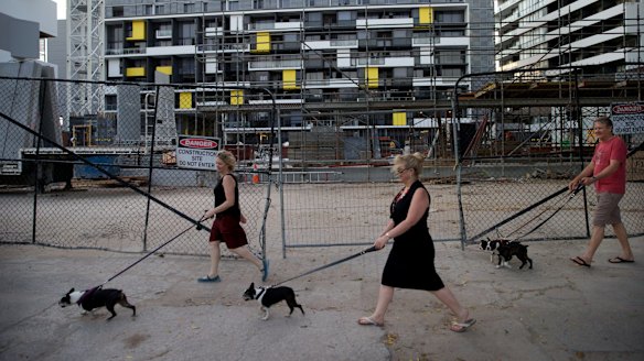 Linda King (left) and Eileen and Mark Woodbridge walk through the area.