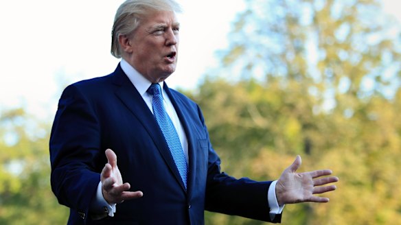 President Donald Trump speaks to reporters upon his return to the White House on  Sunday.