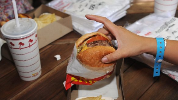 Customers enjoy burgers at the In-N-Out Burger pop-up in Surry Hills.