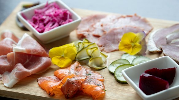 Bowls of tangy pickles add colour and contrast to a charcuterie board.