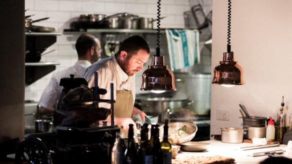 A chef plates up at Tipo 00 in Melbourne, not reopened - yet. 