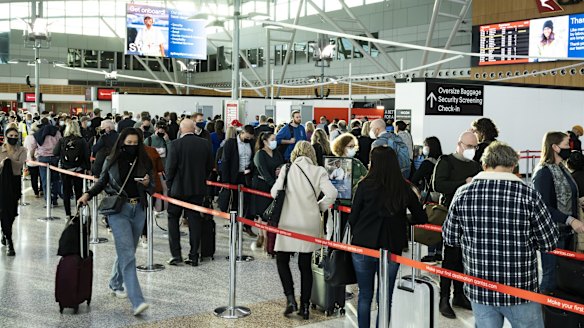 Qantas passengers queue for security checks at Sydney Airport's Terminal 3 last month.