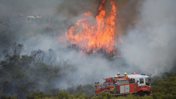 Firefighters tackle an out-of-control bushfire near Bathurst on Tuesday.