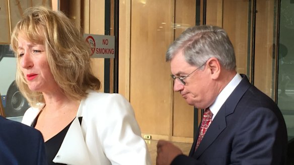 John Kearsley leaving the Downing Centre District Court accompanied by his solicitor.