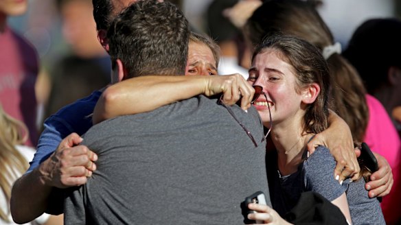 A family reunites following the shooting at Marjory Stoneman Douglas High School.