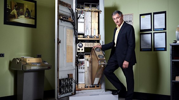 Leonard Kleinrock stands next to a specialised computer — a forerunner to today's routers — that sent the first message over the internet in 1969.