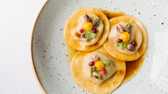 Duck ravioli with pomegranate sauce.