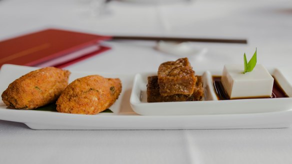 Tofu served three ways including Shao Lin puffs (left).