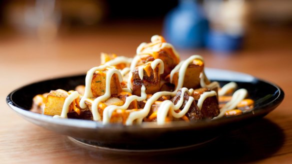 Potatoes squiggled with pepperonata and aioli.