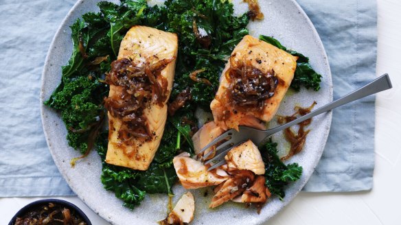 Quick, healthy dinner: Salmon fillets with caramelised onion and wilted greens.