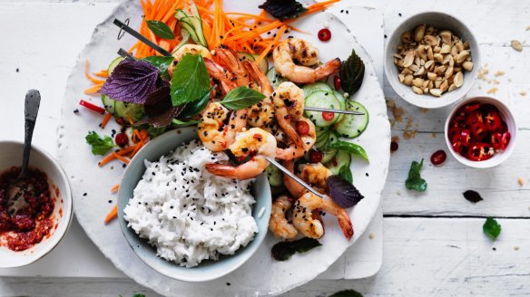 Coconut rice with quick pickled vegetables and prawn skewers.