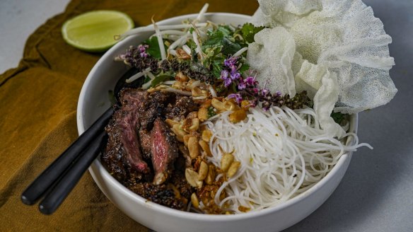 Black pepper and makrut lime beef bowl with vermicelli noodles and herb salad.