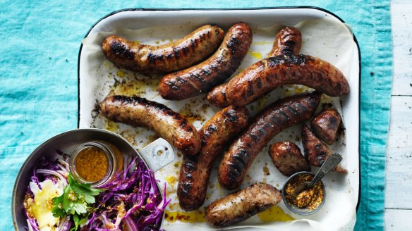 Barbecued sausages with red cabbage and mustard salad.