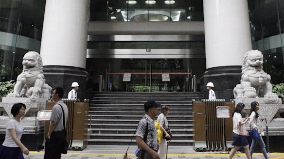 People walk past the Guangzhou Intermediate People's Court, in Guangzhou, where Australian/New Zealander Peter Gardner is appearing on drug smuggling charges.