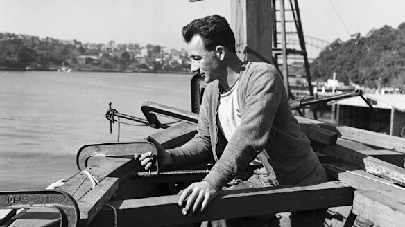 Boat builder Reg Holmes, pictured at Lavender Bay on 20 September 1956, building a boat to take guests crocodile hunting in the Gulf. 