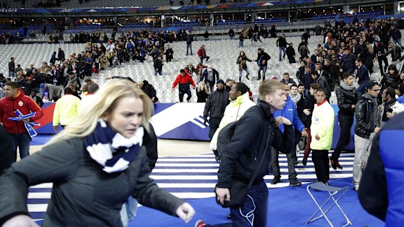 Spectators invade the pitch after the match.