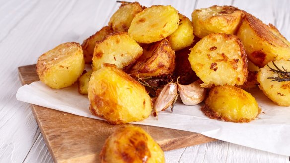 Partly cook potatoes before tossing in fat and roasting for a crisp finish.