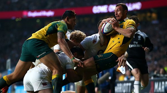 Quade Cooper is smashed in tackle.