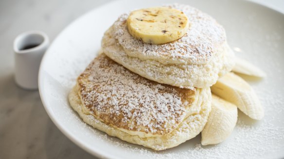 Ricotta hotcakes with banana and honeycomb butter.