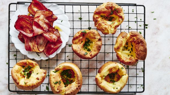 Mini Dutch babies with maple syrup and crispy bacon.