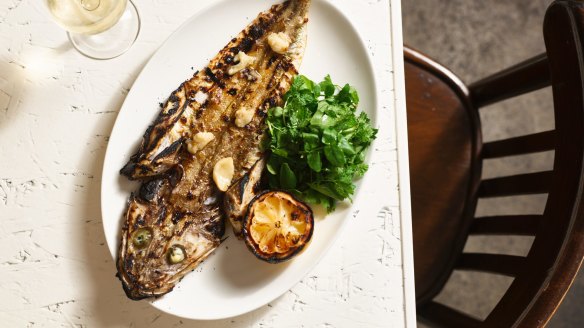 A grill and wood-fired oven will bring char to whole fish caught locally.