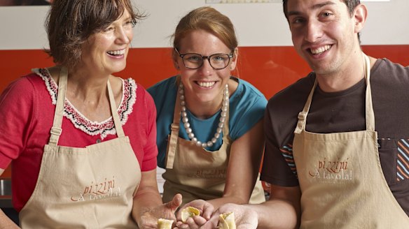 Katrina Pizzini (left) and her cooking school.
