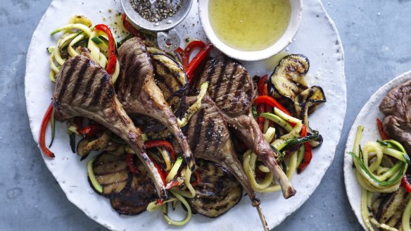 Barbecued lamb cutlets with salad and mint jelly. 