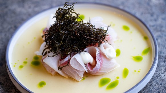 Kingfish with kohlrabi, tomato dashi, pickled green chilli and vine leaves.