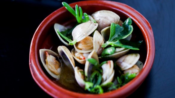 Clams opened over the fire and served in a pool of buttery juices.