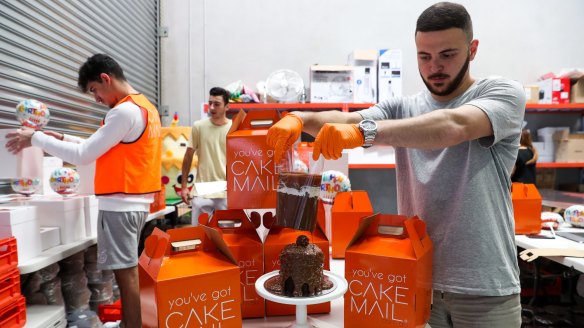 Cake Mail founder Jonathan Massaad prepares a birthday cake at his production site in Smithfield.