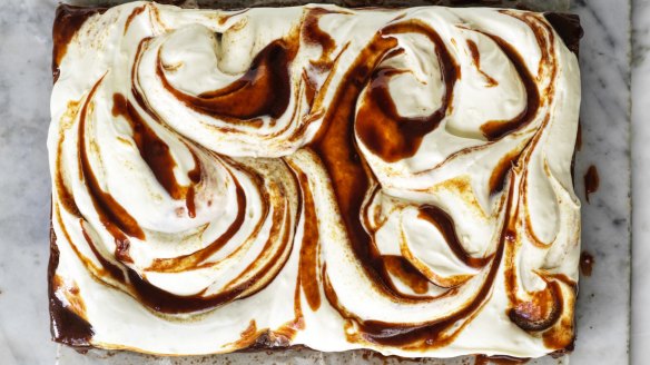 A slab of banana cake with cream cheese icing and swirls of optional  miso caramel.