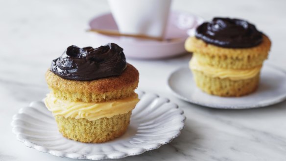 Boston cream cupcakes sandwiched with whipped coconut custard.