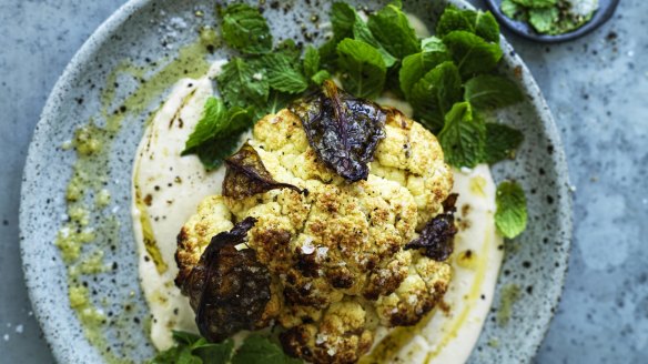 Whole roasted cauliflower with hummus and honey.