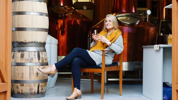 Jane Sawford relaxes with a glass at Sawford Distillery.