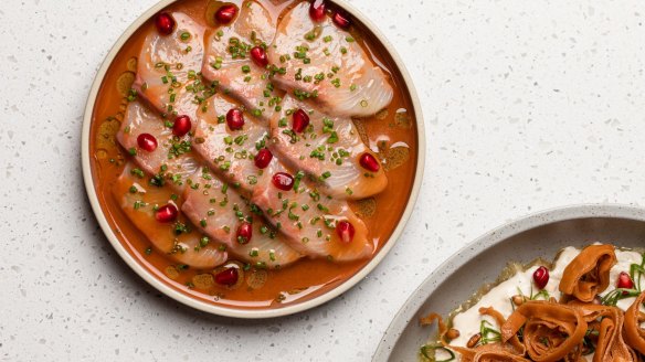 Raw kingfish with tomato, pomegranate and chives.