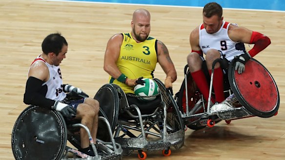 Ryley Batt in action against Chuck Aoki and Eric Newby of the United States.